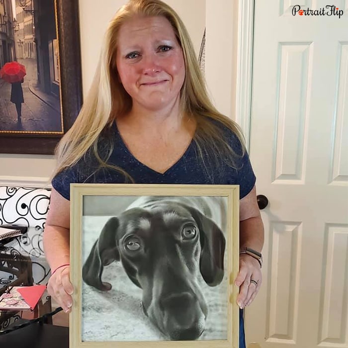 Happy PortraitFlip customer posing with their hand-painted portrait