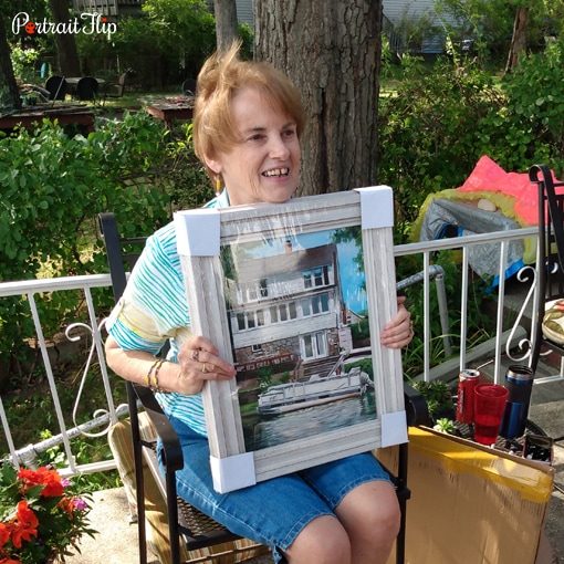 Customer proudly displaying their handmade PortraitFlip painting