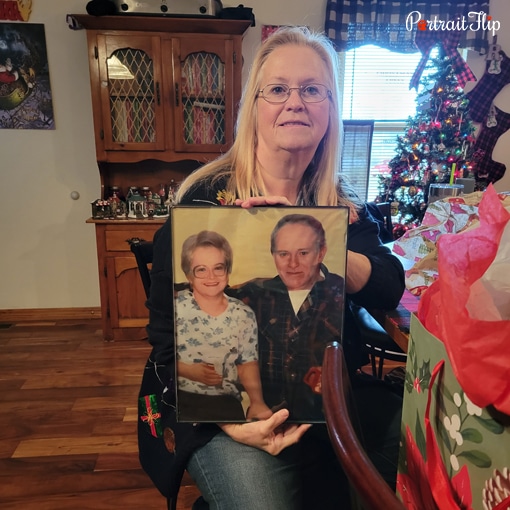 PortraitFlip customer with their finished custom artwork